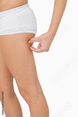Young woman without any fat on her thigh