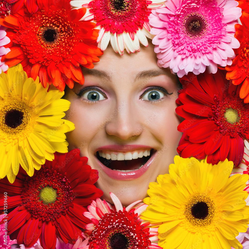 Happy smiling girl with flowers around her face. Gerbera daisy Happy smiling girl with flowers around her face. Gerbera daisy