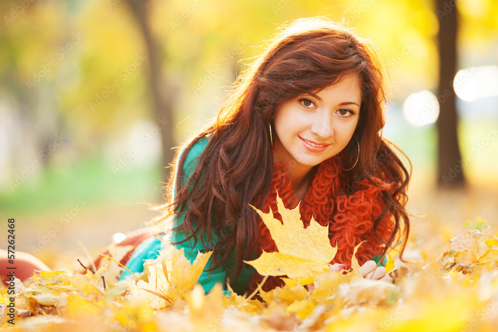 Young pretty woman relaxing in the autumn park Young pretty woman relaxing in the autumn park