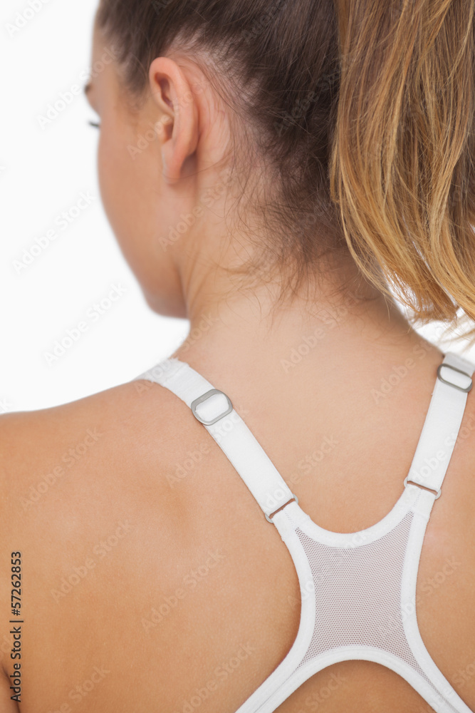 Rear view of young woman wearing a sports bra Rear view of young woman wearing a sports bra