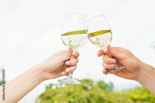 Two glasses being toasted