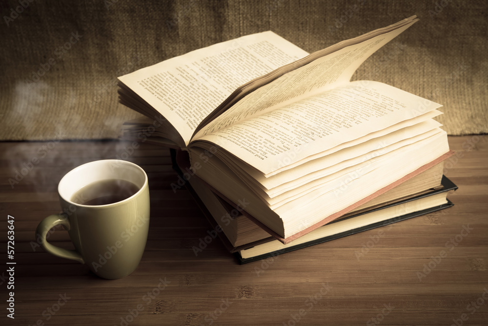 Cup of coffee on old books, desatursted Cup of coffee on old books, desatursted