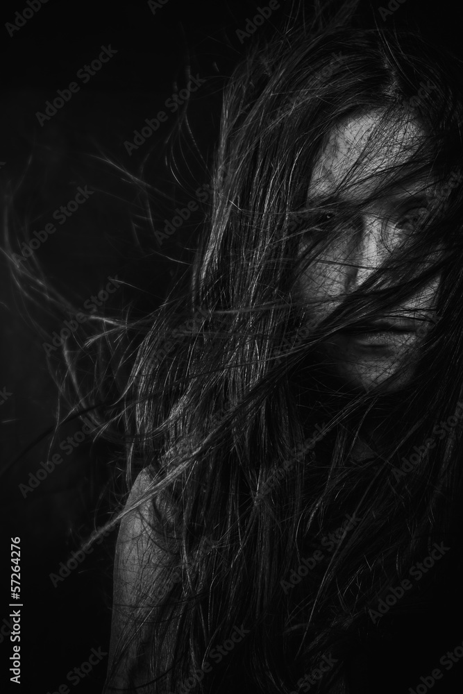 Scary, Portrait of young female beauty with long dark hair in bl Scary, Portrait of young female beauty with long dark hair in bl
