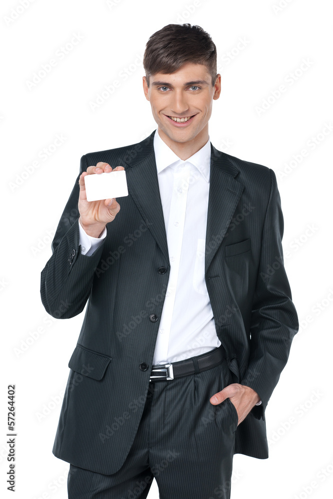 Young smiling business man handing a blank business card. Young smiling business man handing a blank business card.