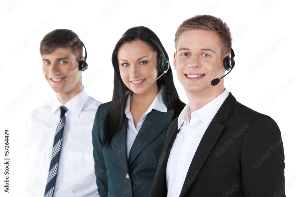 employee working with a headset and accompanied by his team. employee working with a headset and accompanied by his team.