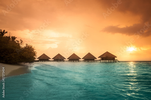 Over water bungalows with steps into amazing green lagoon #57273434
