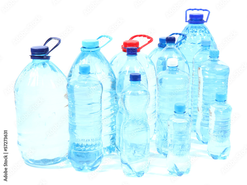Water in different bottles isolated on white Water in different bottles isolated on white