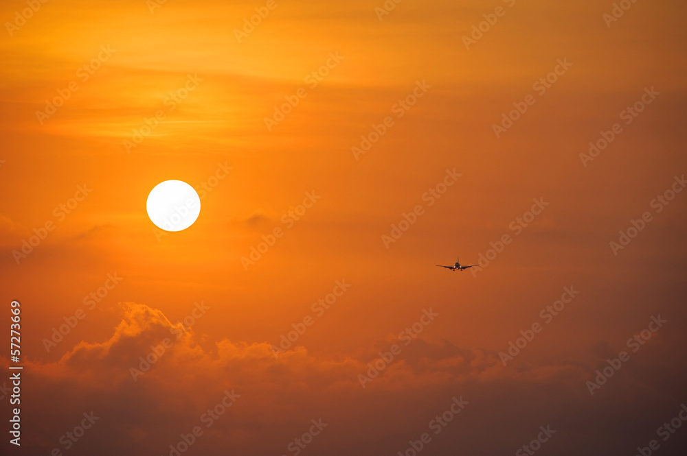 Silhouette of the big plane on a sunset background Silhouette of the big plane on a sunset background