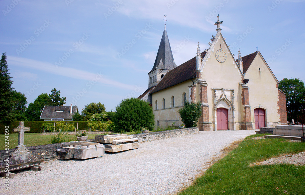 The cemetery and the medieval church in Champagne, France.