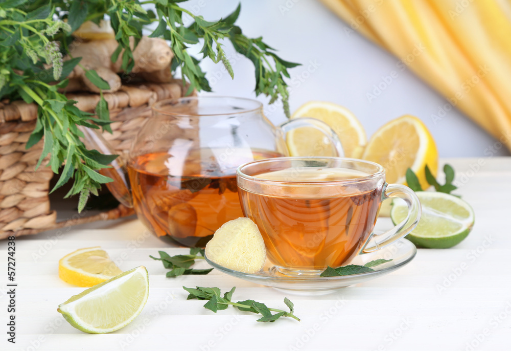 Kettle and cup of tea with ginger Kettle and cup of tea with ginger
