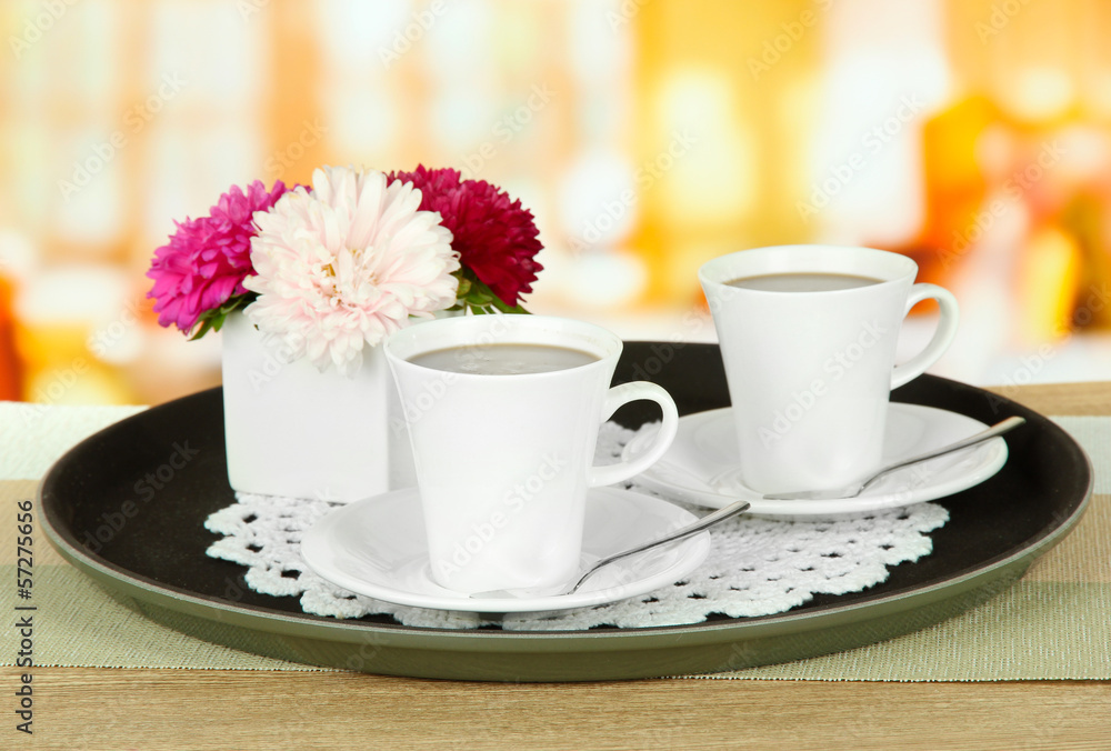 Fototapeta premium Cups of coffee on tray on table in cafe