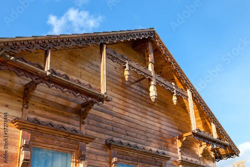 Detail of wooden roof gable on blue sky