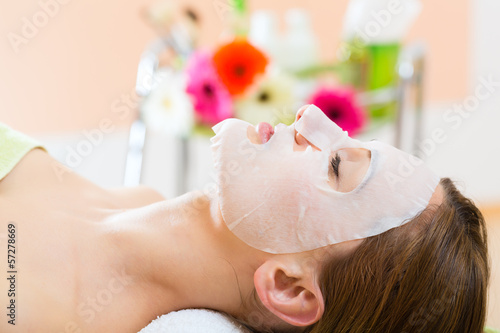 Wellness - woman getting face mask in spa