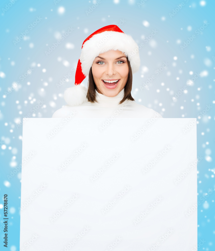 woman in santa helper hat with blank white board woman in santa helper hat with blank white board