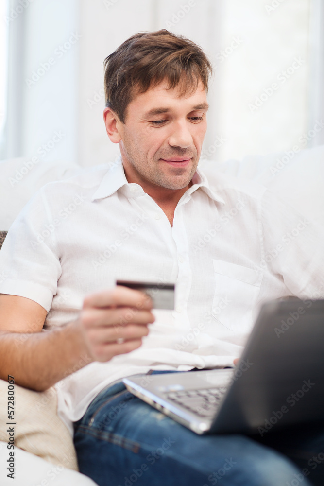 man with laptop and credit card at home man with laptop and credit card at home