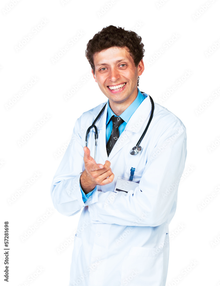 Portrait of a smiling male doctor showing finger at you on white Portrait of a smiling male doctor showing finger at you on white