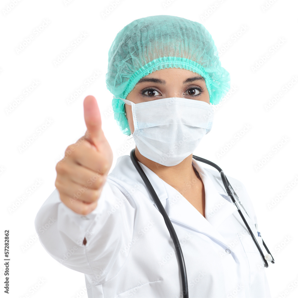 Female doctor with a surgical mask with thumb up Female doctor with a surgical mask with thumb up