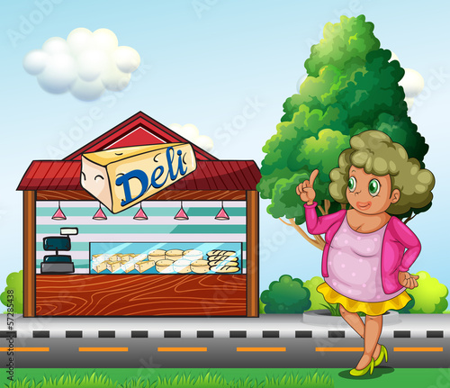 A fat lady in front of the deli store
