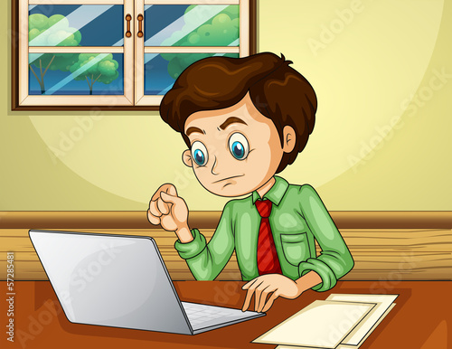 A man using the laptop inside the house