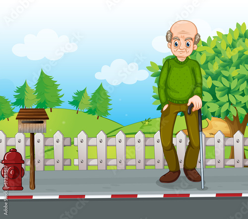 An old man at the road with a cane