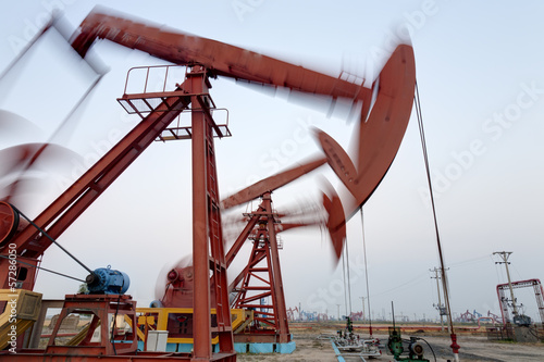 Working oil pump at dusk, motion blurred