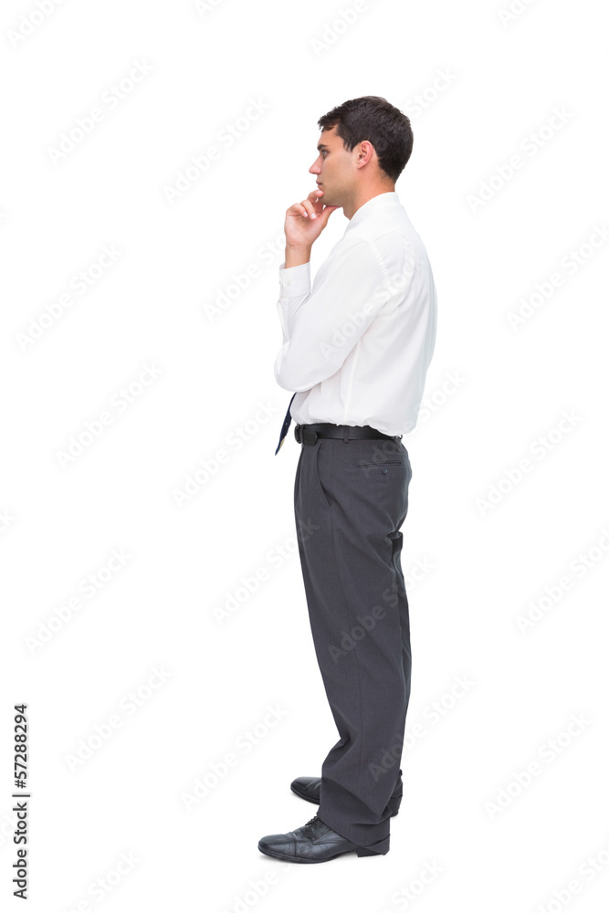 Thoughtful young businessman looking away Thoughtful young businessman looking away