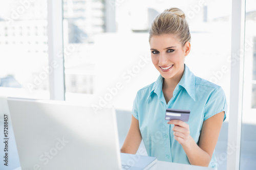 Happy smart businesswoman shopping online