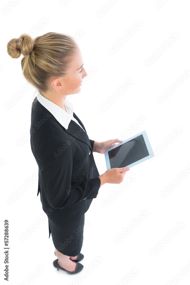 High angle view of young businesswoman holding her tablet High angle view of young businesswoman holding her tablet