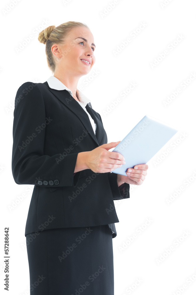 Low angle side view of blonde attractive businesswoman holding h