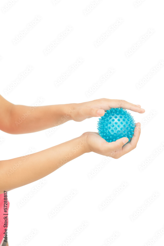 Close up of female hands holding blue massage ball Close up of female hands holding blue massage ball