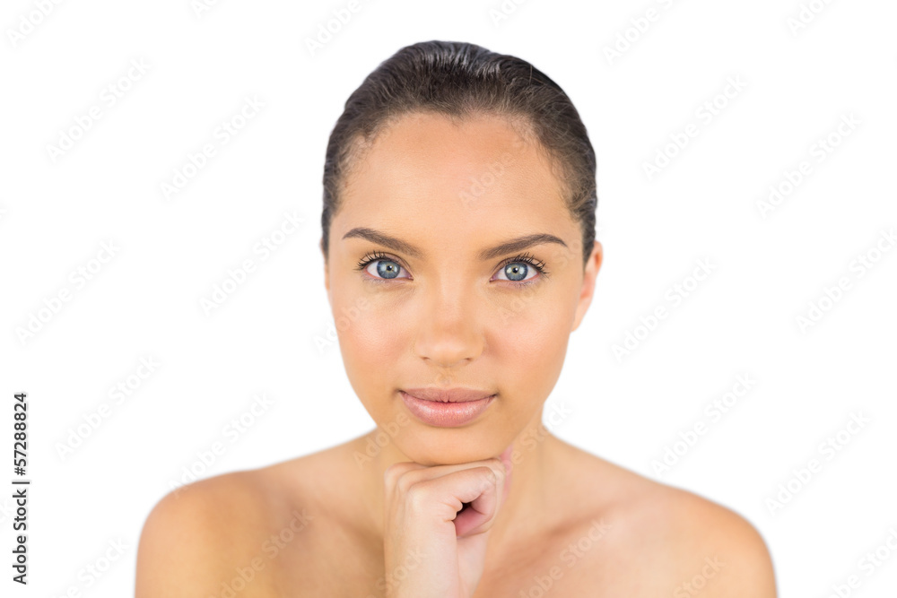 Cheerful woman holding her hand under her chin Cheerful woman holding her hand under her chin