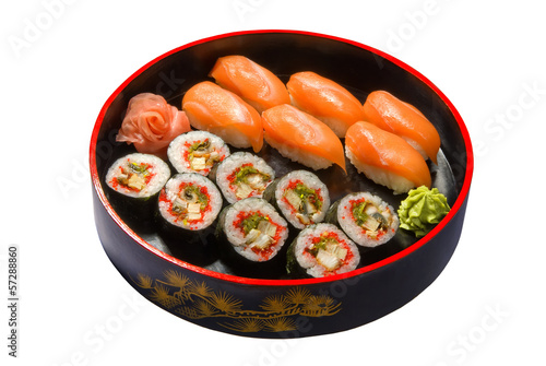 nigiri sushi set in a round wooden plate