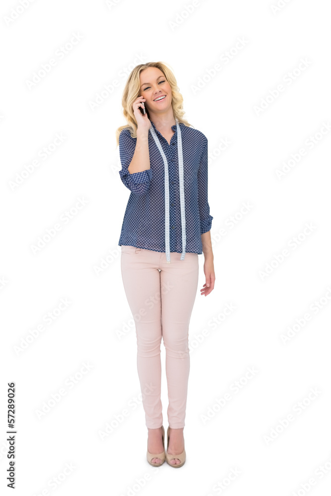 Fototapeta premium Cheerful pretty fashion designer on the phone