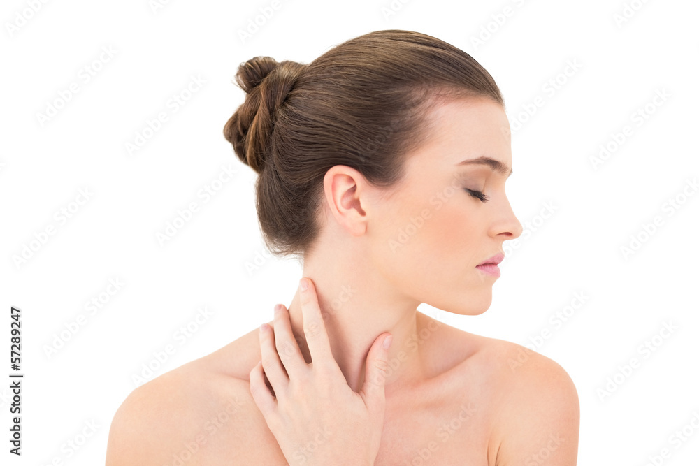 Serious woman closing her eyes and touching her neck Serious woman closing her eyes and touching her neck