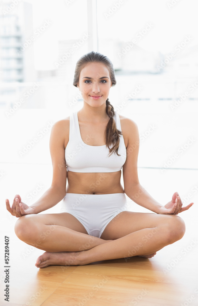 Smiling relaxed brunette meditating Smiling relaxed brunette meditating