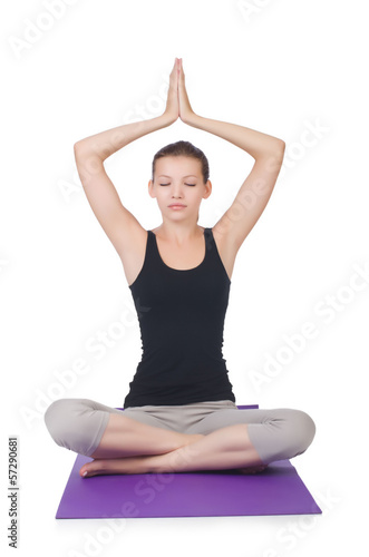 Young female doing exercises on white