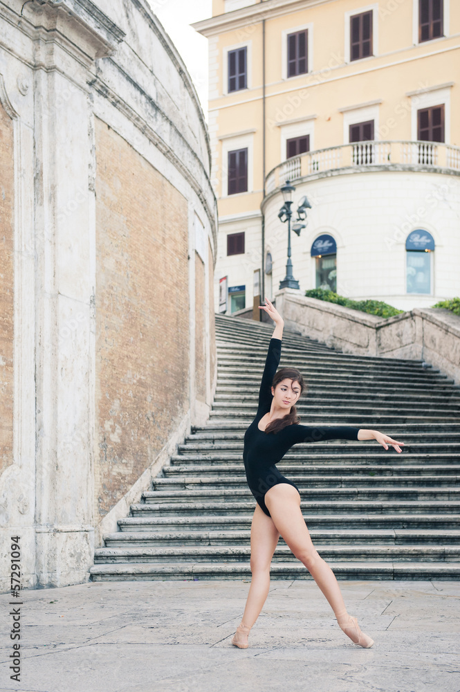 Young beautiful ballerina dancing on the Spanish Steps in Rome,