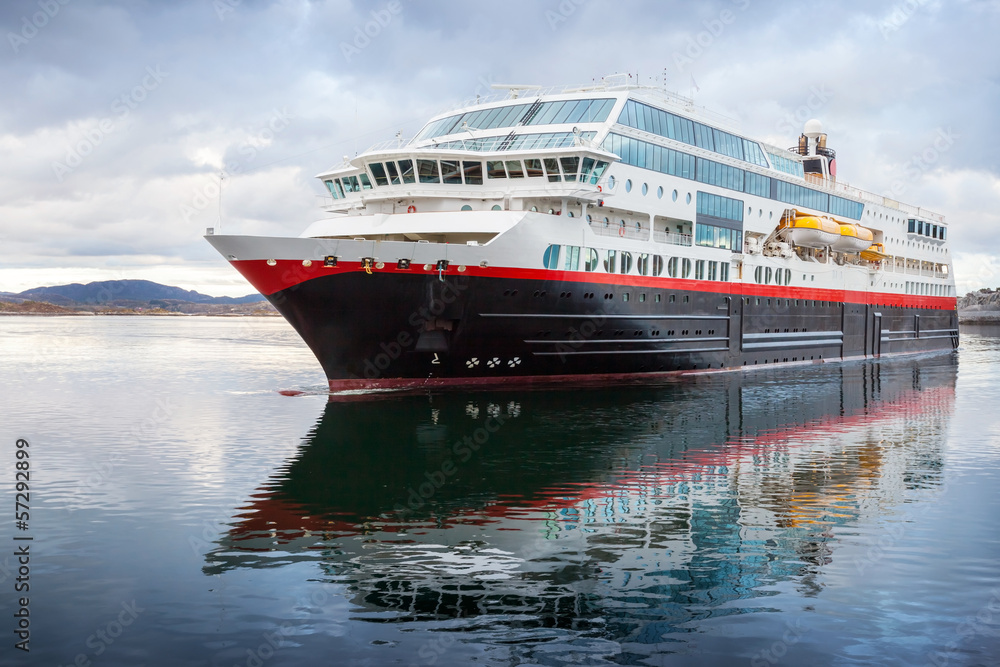 Big passenger cruise ship sails in Norwegian fjord