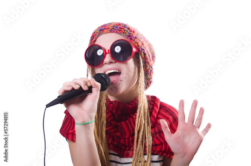 Young female singer with mic on white