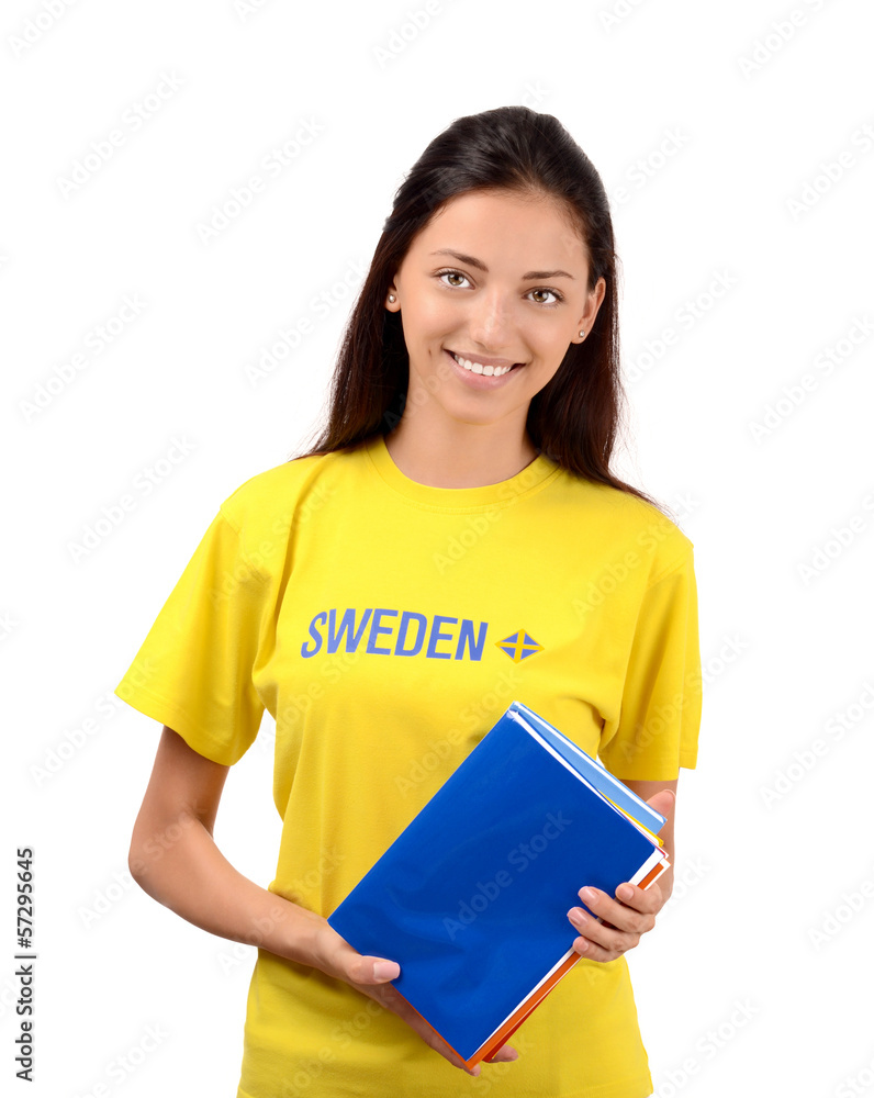 Student with Sweden flag on the yellow blouse holding books Student with Sweden flag on the yellow blouse holding books