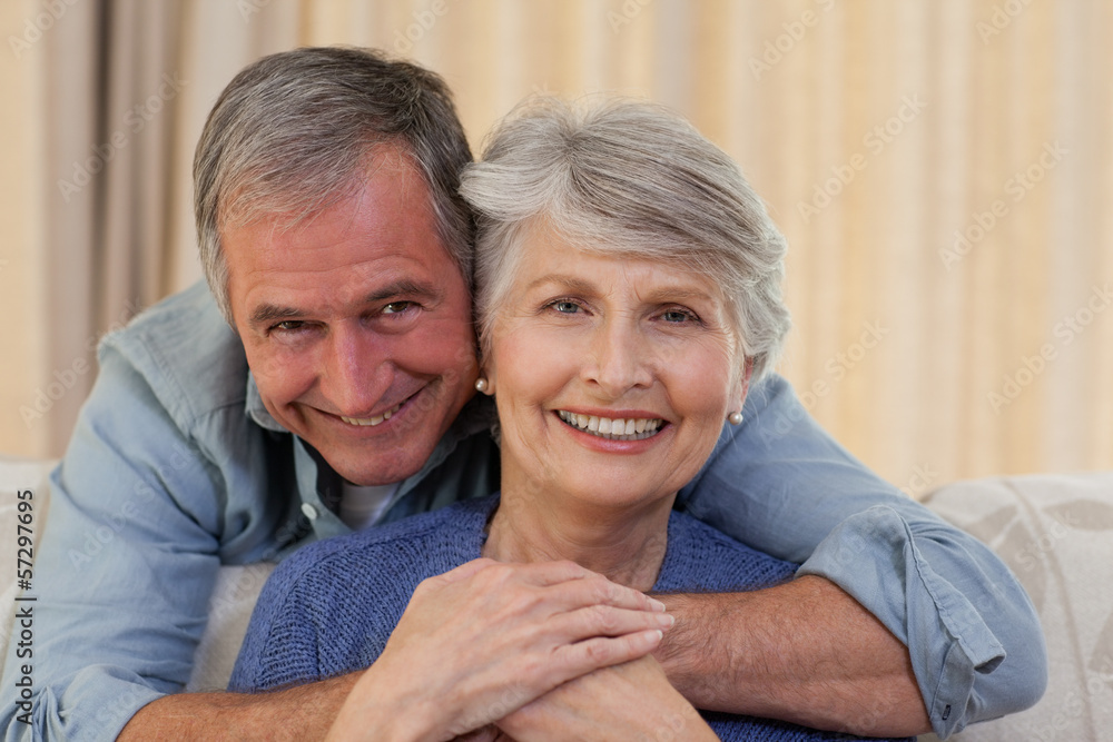 Mature man hugging his wife Mature man hugging his wife