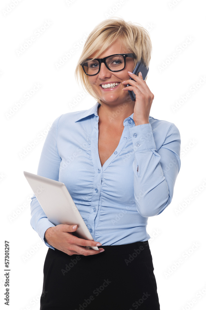 Smiling businesswoman with mobile phone and digital tablet . Smiling businesswoman with mobile phone and digital tablet .