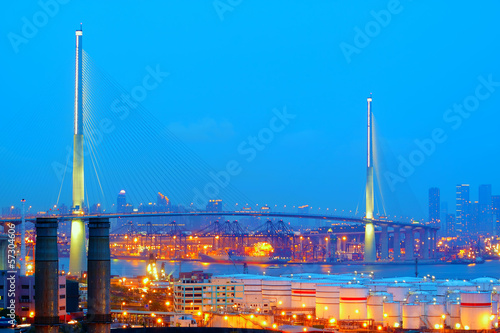 gas tank and highway bridge