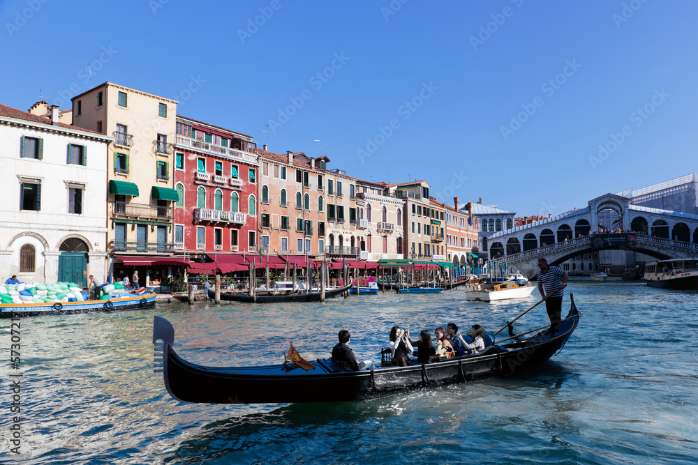 Venice, Italy. Gondola with tourists floats on Grand Canal