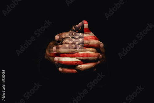 Crossed hands with USA flag photo