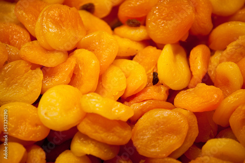 Background of bright orange dried apricots