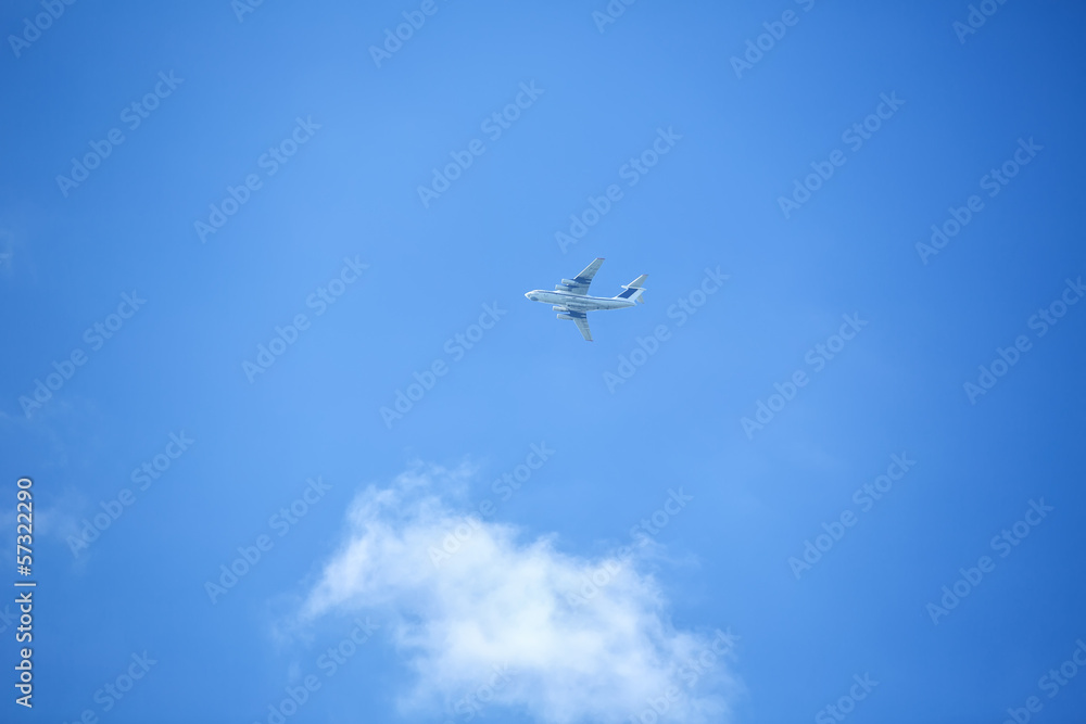 Flying airplane on the blue sky Flying airplane on the blue sky