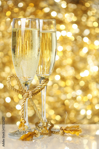 Champagne flutes with golden background