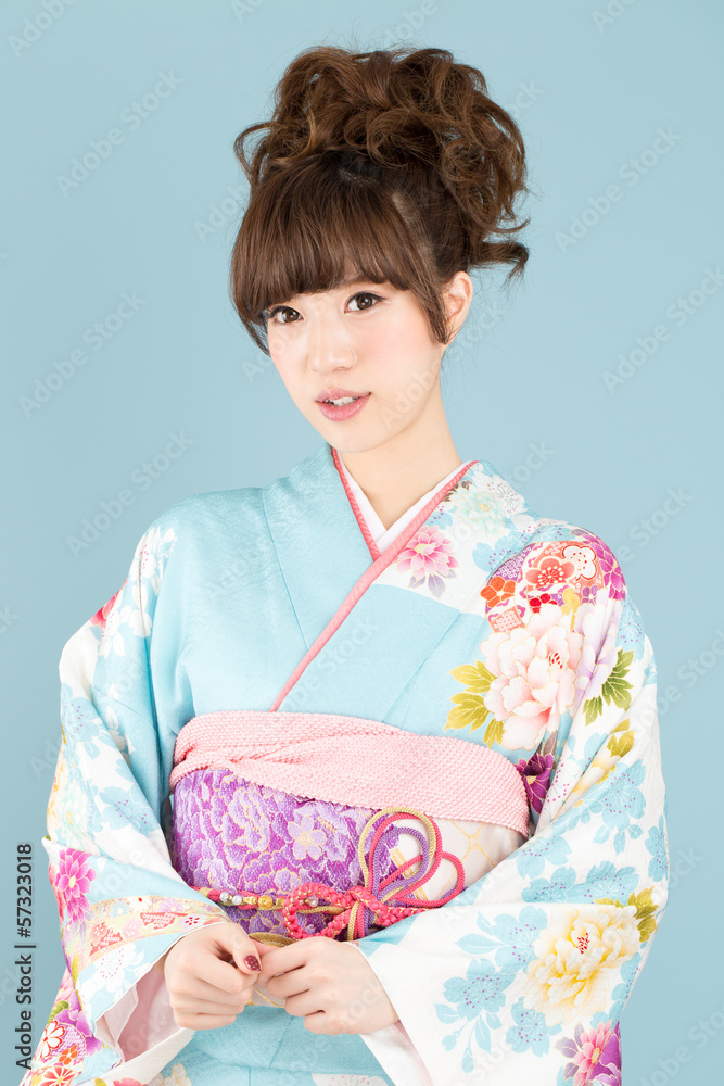 Beautiful asian kimono woman on blue background Beautiful asian kimono woman on blue background