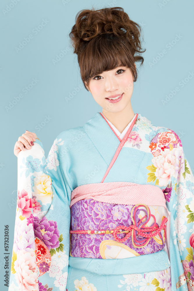 Beautiful asian kimono woman on blue background Beautiful asian kimono woman on blue background